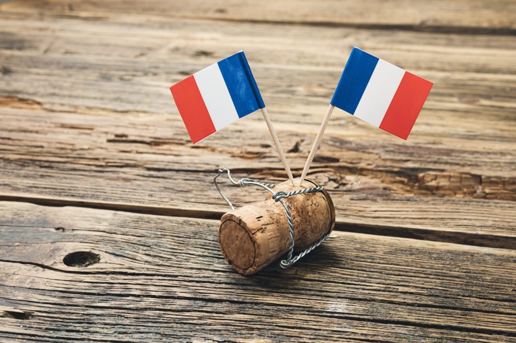 French flags on a champagne bottle cork